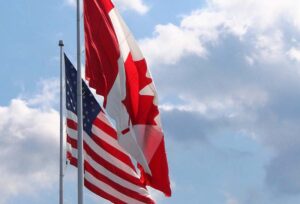 Canada and USA flags flying together